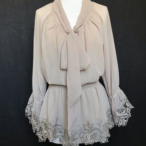 Blouse with lace hem